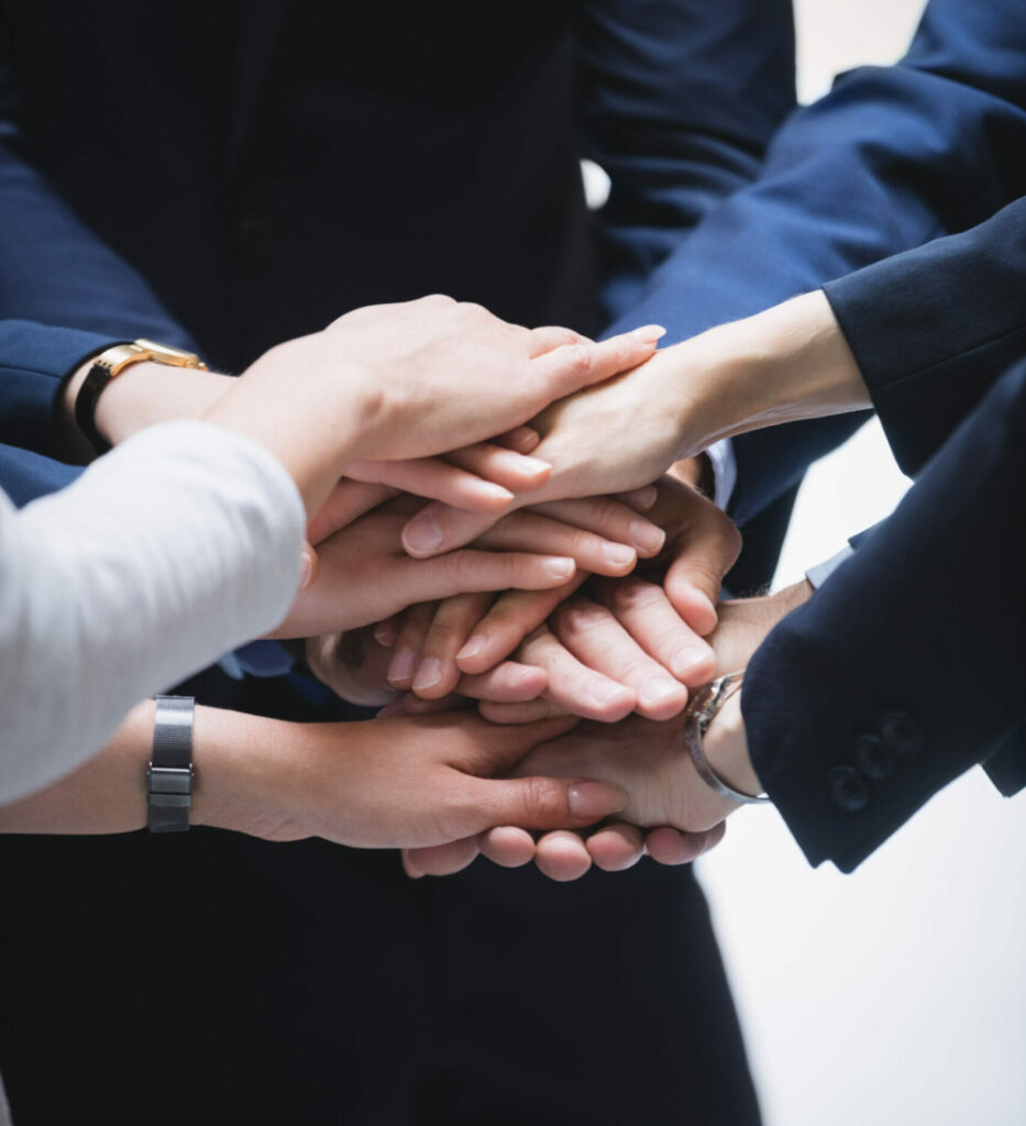 hands stack business people scaled e1690187891527